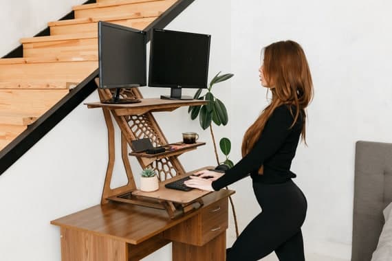 Etsy seller working on laptop home office desk
